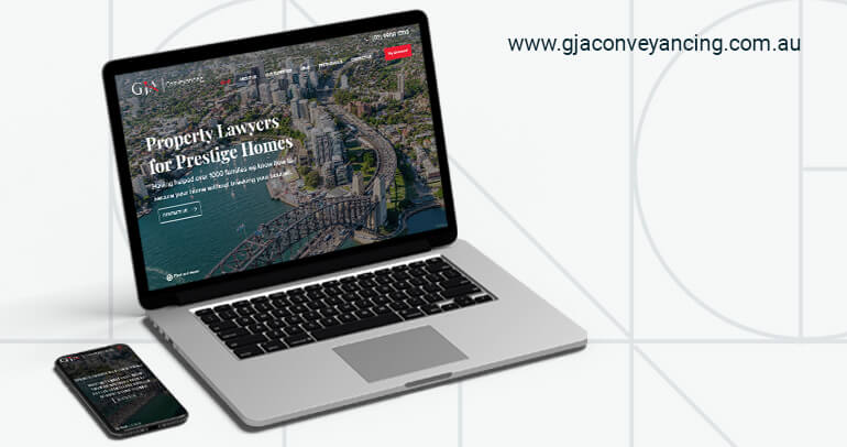 A laptop and a phone showing the GJA Conveyancing Website