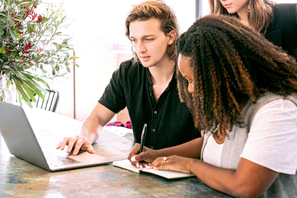 man working on laptop while woman takes notes 3153199 1024x683 1